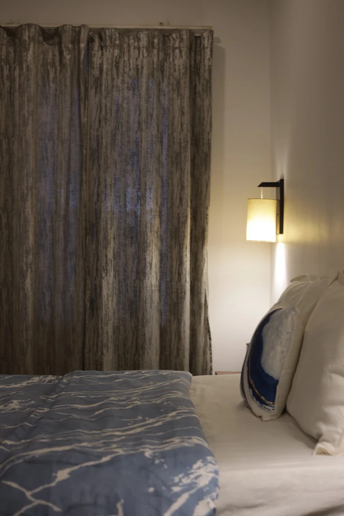 Boutique bedroom with warm lamp light